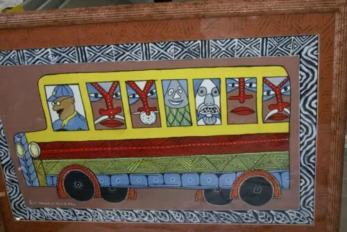 RARE UNIQUE COLORFUL  FOLK ART PAINTING PAPUA NEW GUINEA HUMOROUS ARTIST: TRIBAL WARRIORS TRAVELLING BY BUS & FRAMED IN SIGNED HAND PAINTED FRAME TO MATCH THE ART DESIGNER COLLECTOR WALL CARTOON  ART  38" X 27” HUGE DFP1